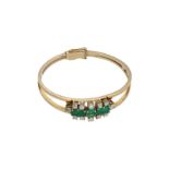 A 14-kt gold hinged bracelet set with emeralds, in total approx. 3.9 ct. and old european and transi