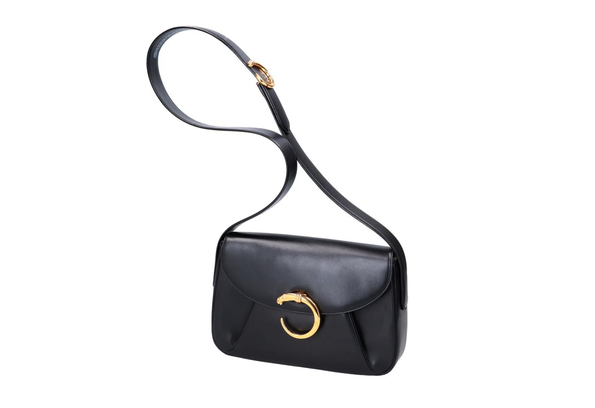 Cartier, black leather handbag, 'Panthere', with red leather interior and wallet. H x W x D: 19 x 28