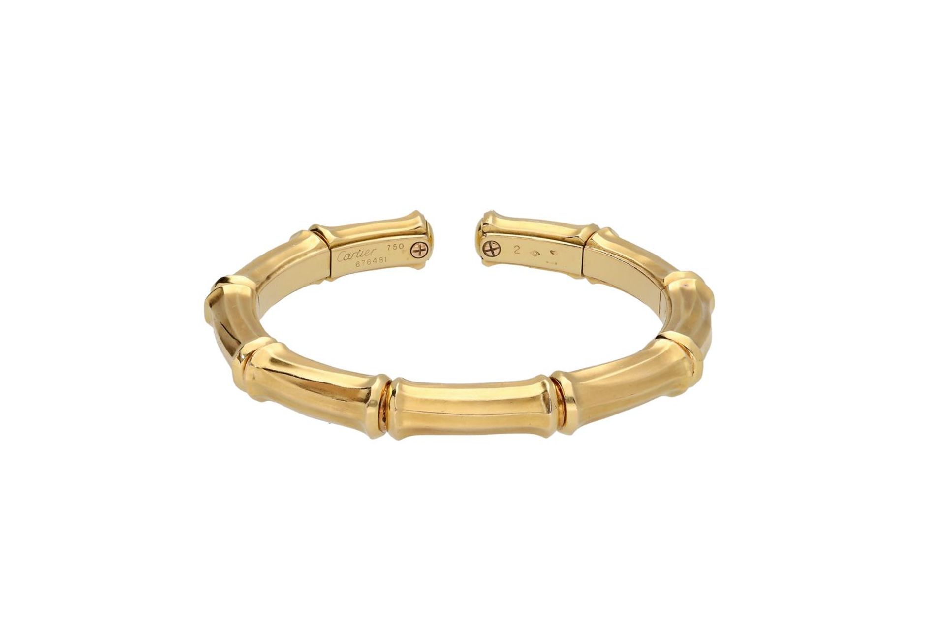 Cartier, an 18-kt gold cuff bracelet, 'Bamboo', No. 676481.
H x W: 6.5 x 7.5 cm. Total weight: 53.6  - Bild 2 aus 3