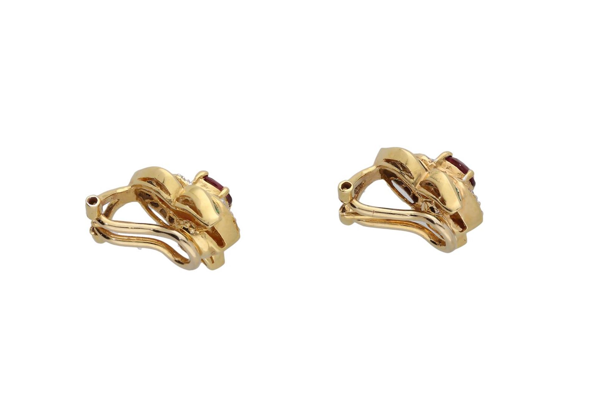 A pair of 18-kt gold earclips set with ruby, approx 0,35 ct. - Image 2 of 3