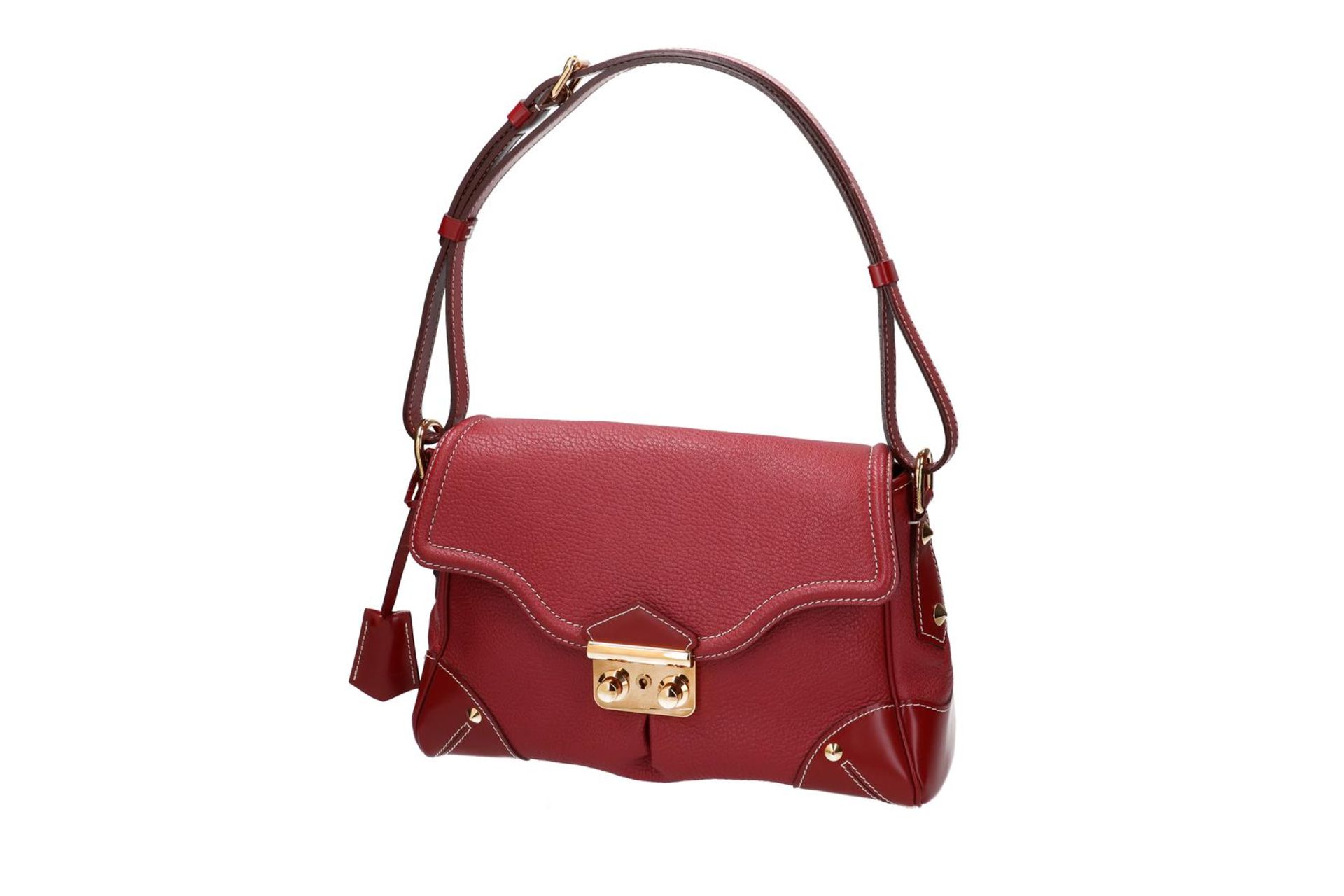 Louis Vuitton, red Suhali leather handbag, 'L'essentiel', with two keys and dustcover. H x W x D: 21