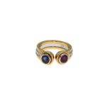 An 18-kt yellow and white gold 'moi et toi' ring, set with a ruby and a saffier, each approx. 0.35 c