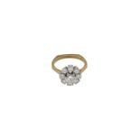 A 14-kt white and yellow gold cluster ring, set with brilliant cut diamonds, central stone approx. 0