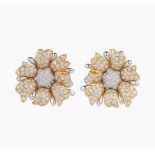 A Pair of flowershaped bicolour Diamond Earrings.