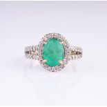 An Emerald Diamond Ring.