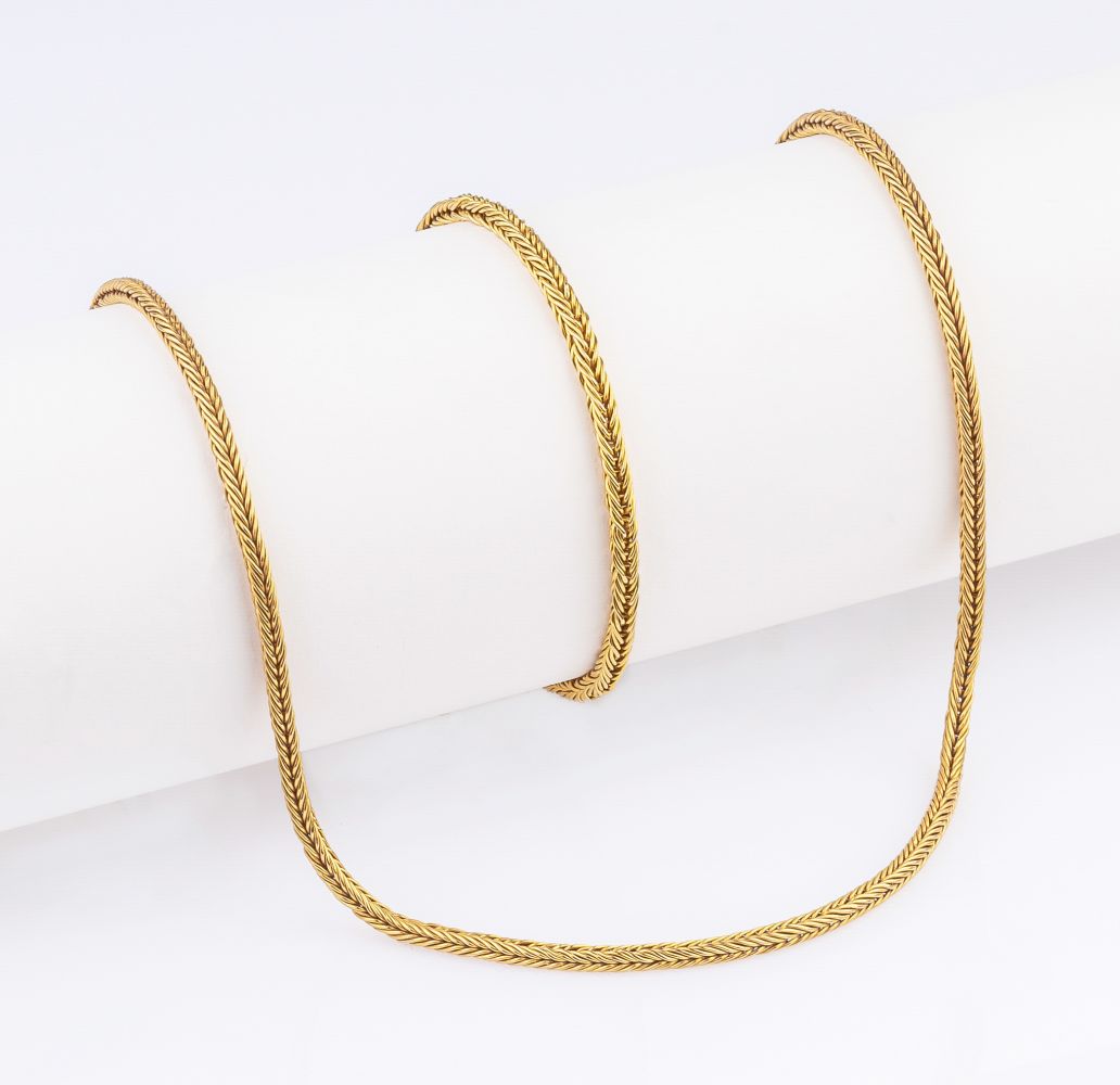 A Gold Necklace with matching Bracelet.