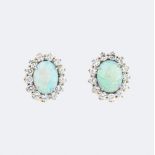 A Pair of Opal Diamond Earclips.