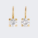 Brahmfeld & Gutruf. A Pair of fine-white Solitaire Earrings.