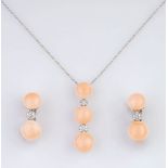 A Coral Diamond Jewellery Set with Pendant and Pair of Earrings.