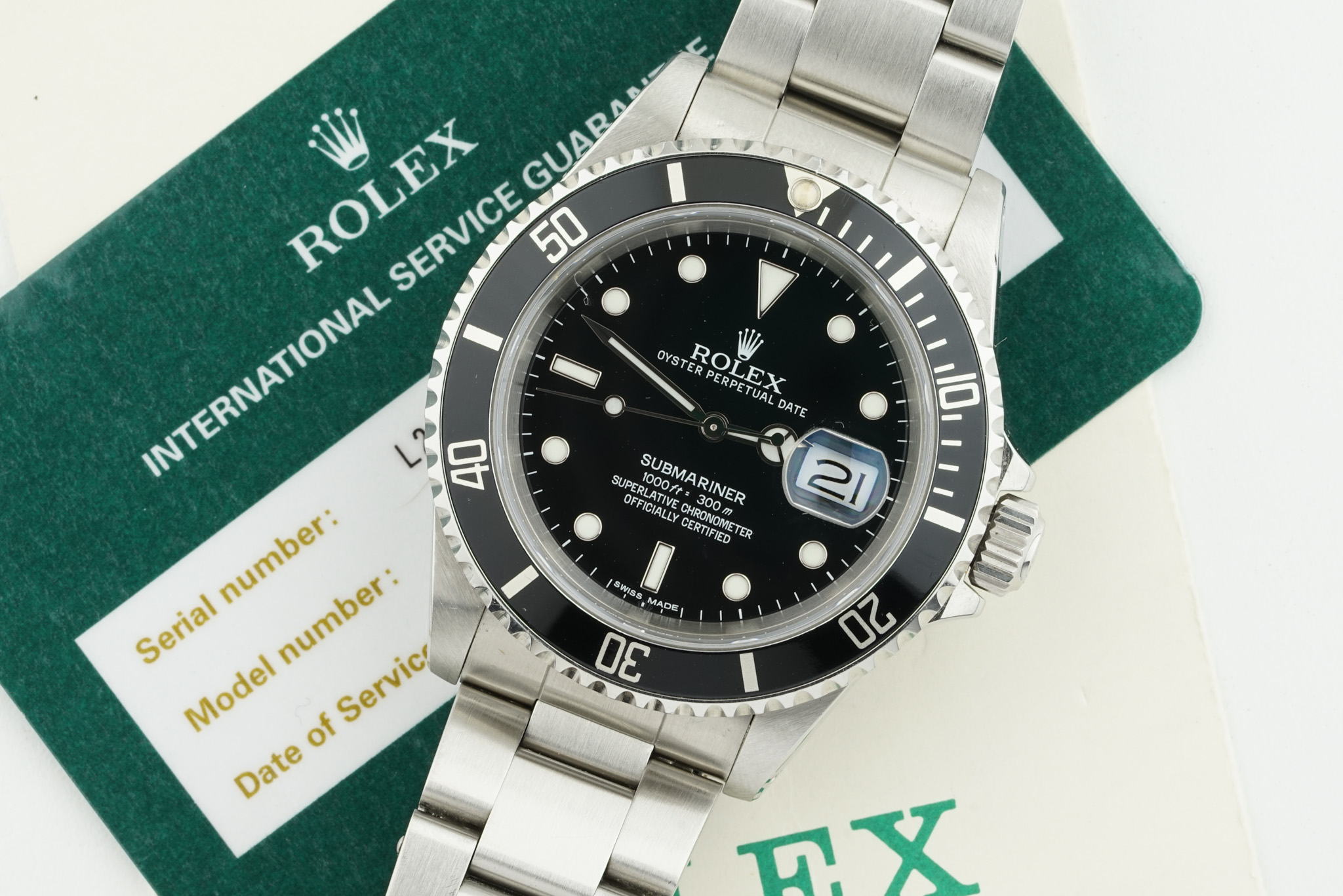 ROLEX OYSTER PERPETUAL DATE SUBMARINER W/ GUARANTEE PAPERS REF. 16610 CIRCA 1989