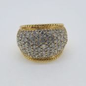 Yellow gold diamond pave set bombe ring. Estimated 2.50 carats Marked 18K and 750 Weight 15.2g