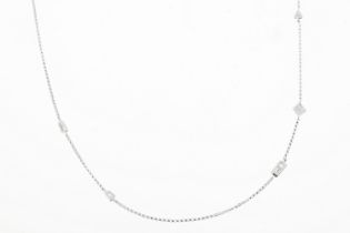 An 18ct white gold 18inch chain randomly set with multi-diamond shapes. Estimated total diamond