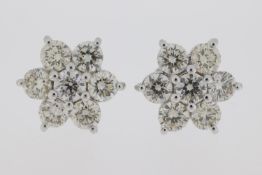18ct White gold cluster earrings each comprising 7 diamonds, totalling 2.0 carats.