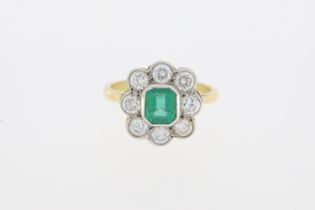 Yellow gold emerald and diamond cluster ring (Emerald 0.90 carats, diamonds total 1.05 carats).
