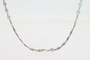 Circa 1920, A platinum and pearl chain 9 pearls. Chain length approx 50cm.