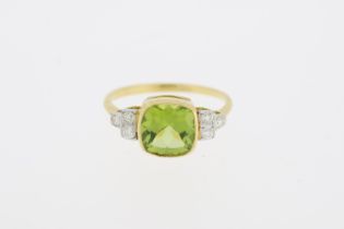 Stamped 18ct, yellow gold, rub over set peridot and diamond ring. (Peridot 2.10 carats, diamonds