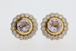 A pair of 18ct morganite & diamond stud earrings.