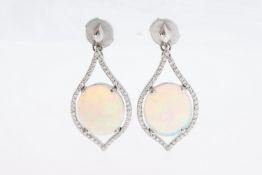 A pair of platinum & opal drop earrings.