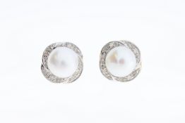A paif of 9ct pearl & diamond stud earrings.