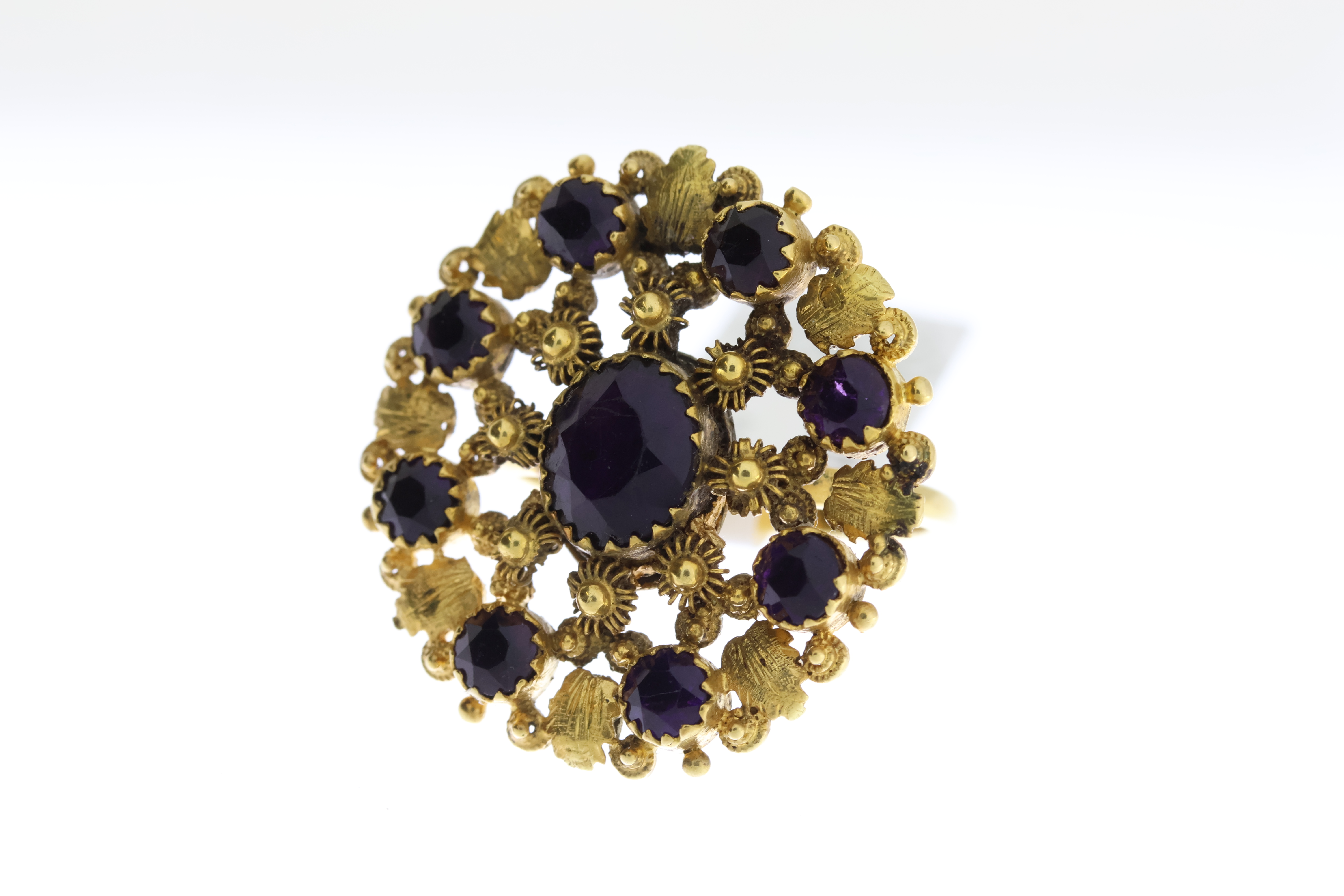 Antique Purple Stone Set Panel Ring, circular design with closed back settings, in yellow metal