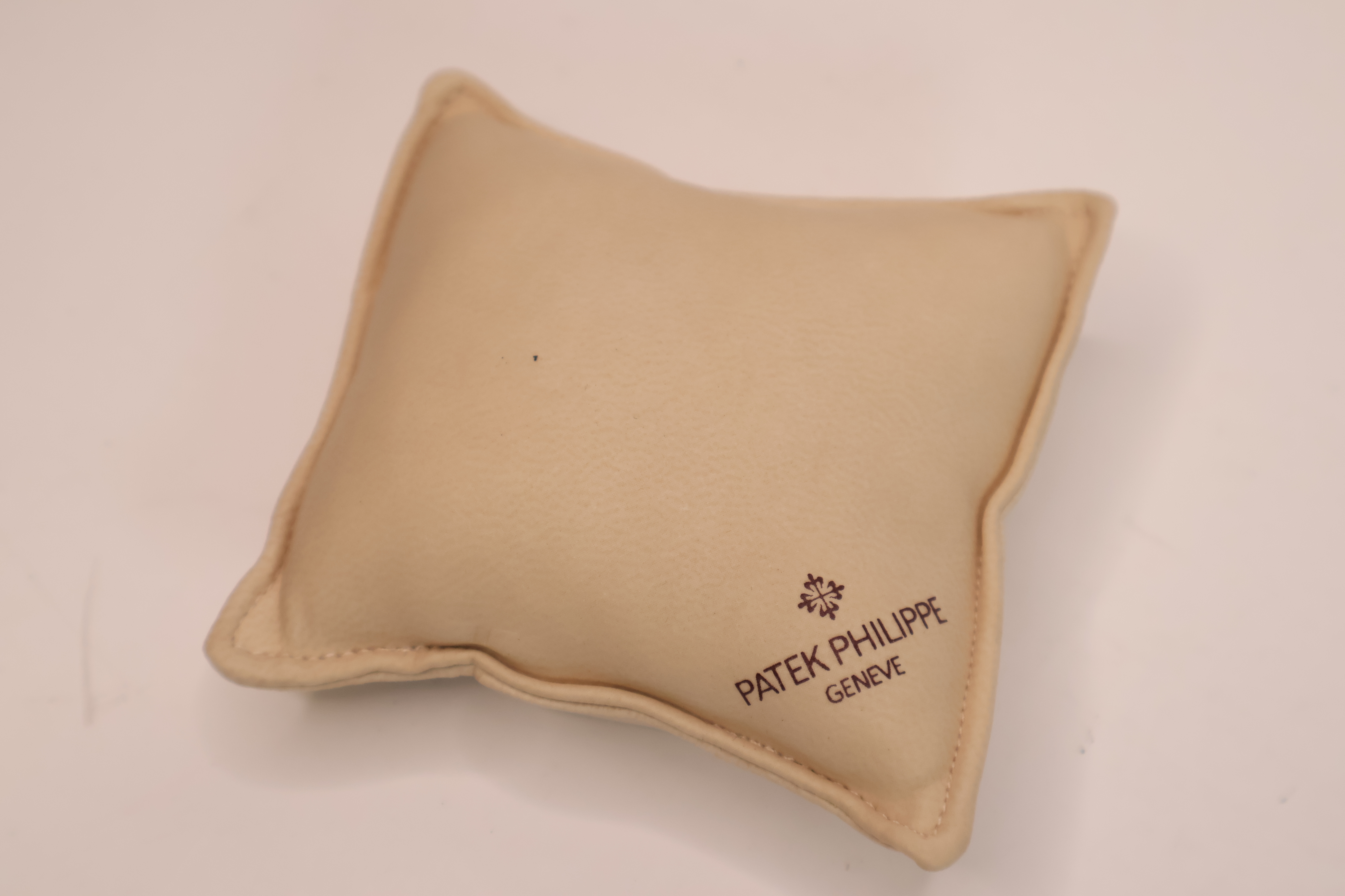 *To Be Sold Without Reserve* Patek Philippe cream branded cushion