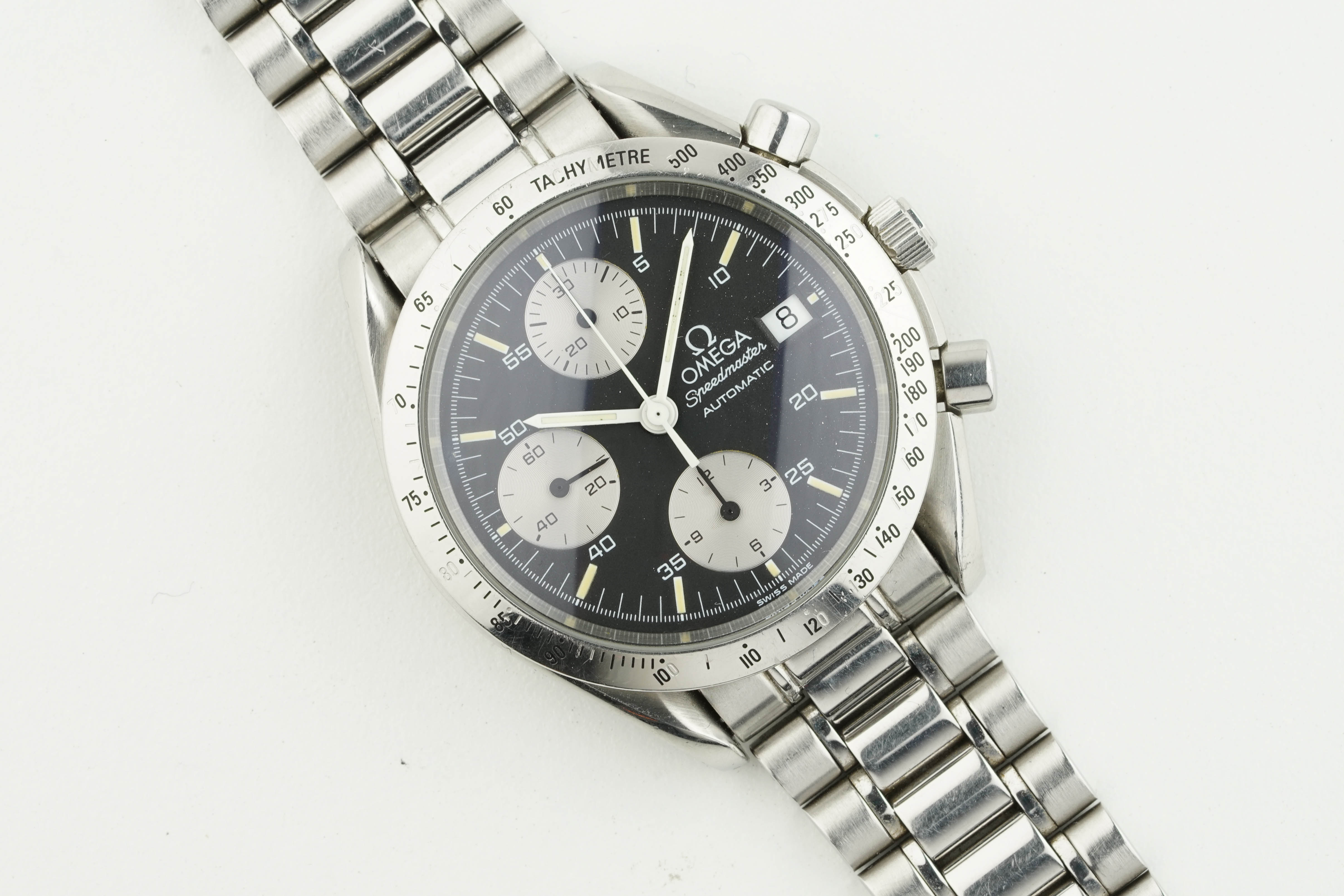 OMEGA SPEEDMASTER AUTOMATIC DATE, circular black dial with hour markers and hands, 39mm case with