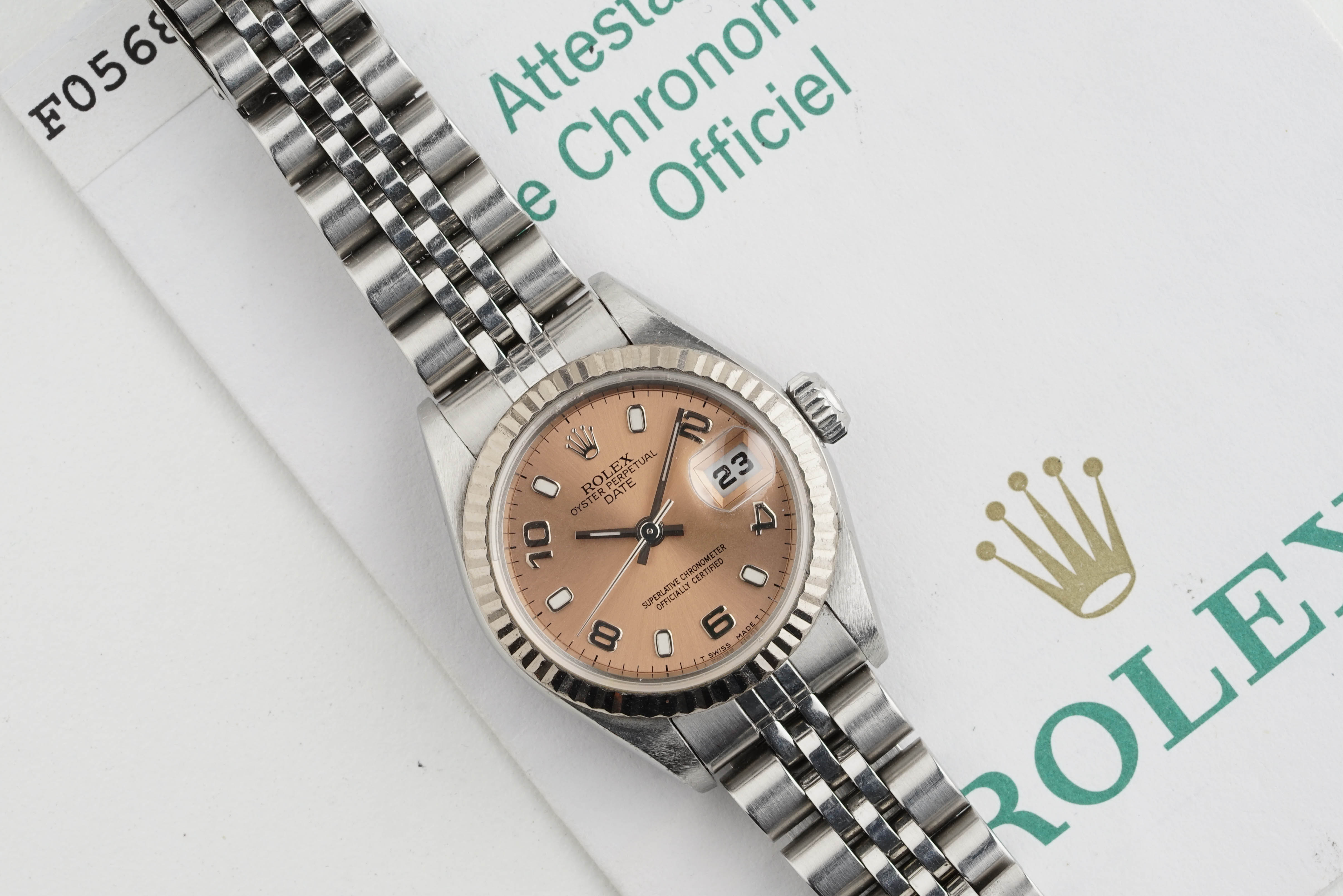 ROLEX OYSTER PERPETUAL DATEJUST W/ GUARANTEE PAPERS REF. 79174 CIRCA 2003, circular salmon dial with