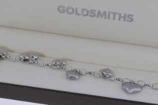 A 9ct White Gold Heart Charm Bracelet. Approx 4.6g
