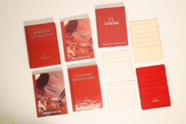 *To Be Sold Without Reserve* OMEGA Assortment of Omega operating instructions and card holders,*sold