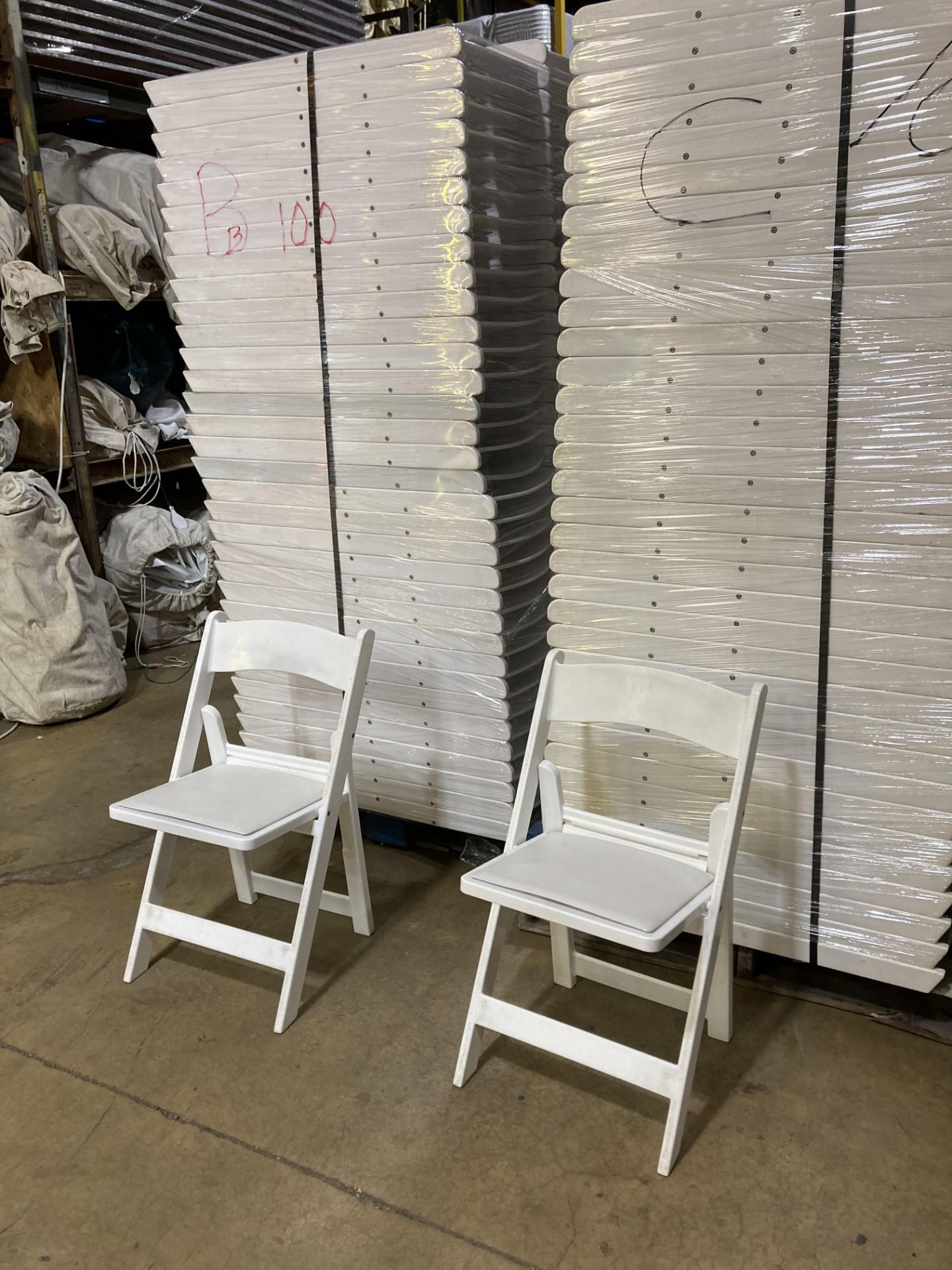 *Located in Tupelo, MS White Resin Padded Folding Chairs, Grade B - Image 2 of 2