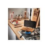 Stove Top Waffle Iron. - PW. The waffle iron will be heated and ready to use in around 3 minutes -