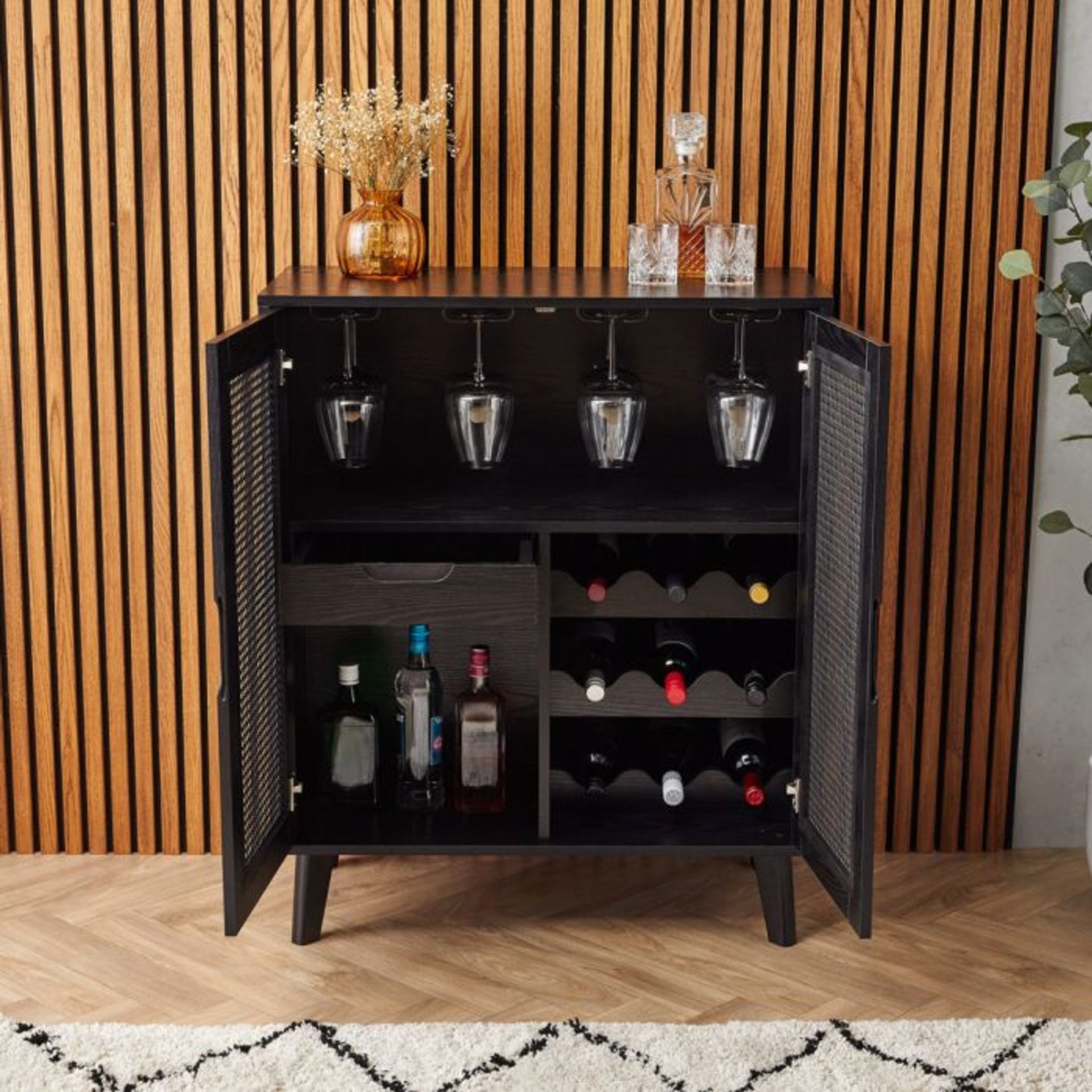Barton Black Rattan Drinks Cabinet. - ER37. Contained within contemporary black rattan doors, our