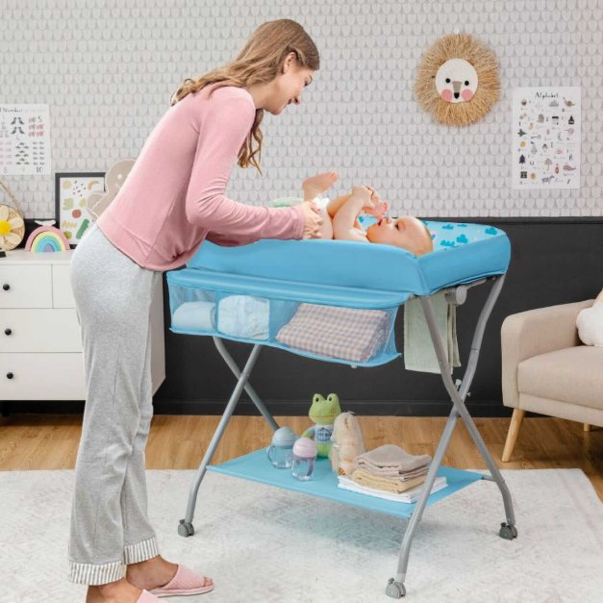 Rolling Baby Changing Table with Large Storage Basket. - R14.3. The changing table cares for the