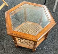 Octagonal glass top Bergere coffee table, approximate measurements: Height 21 inches, Width 23