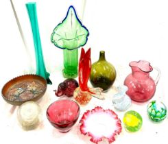 Large selection of coloured glassware to include fish paperweight, carnival glass, cranberry etc