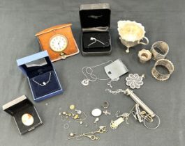 Selection of collectables to include napkin rings, clock keys, Swarovski necklace, travel clock etc