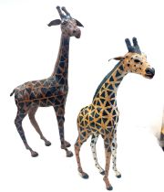 2 leather giraffe figures, tallest measures approximately 21 inches tall