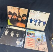 Two Beatles LPS and a compilation album and one album cover