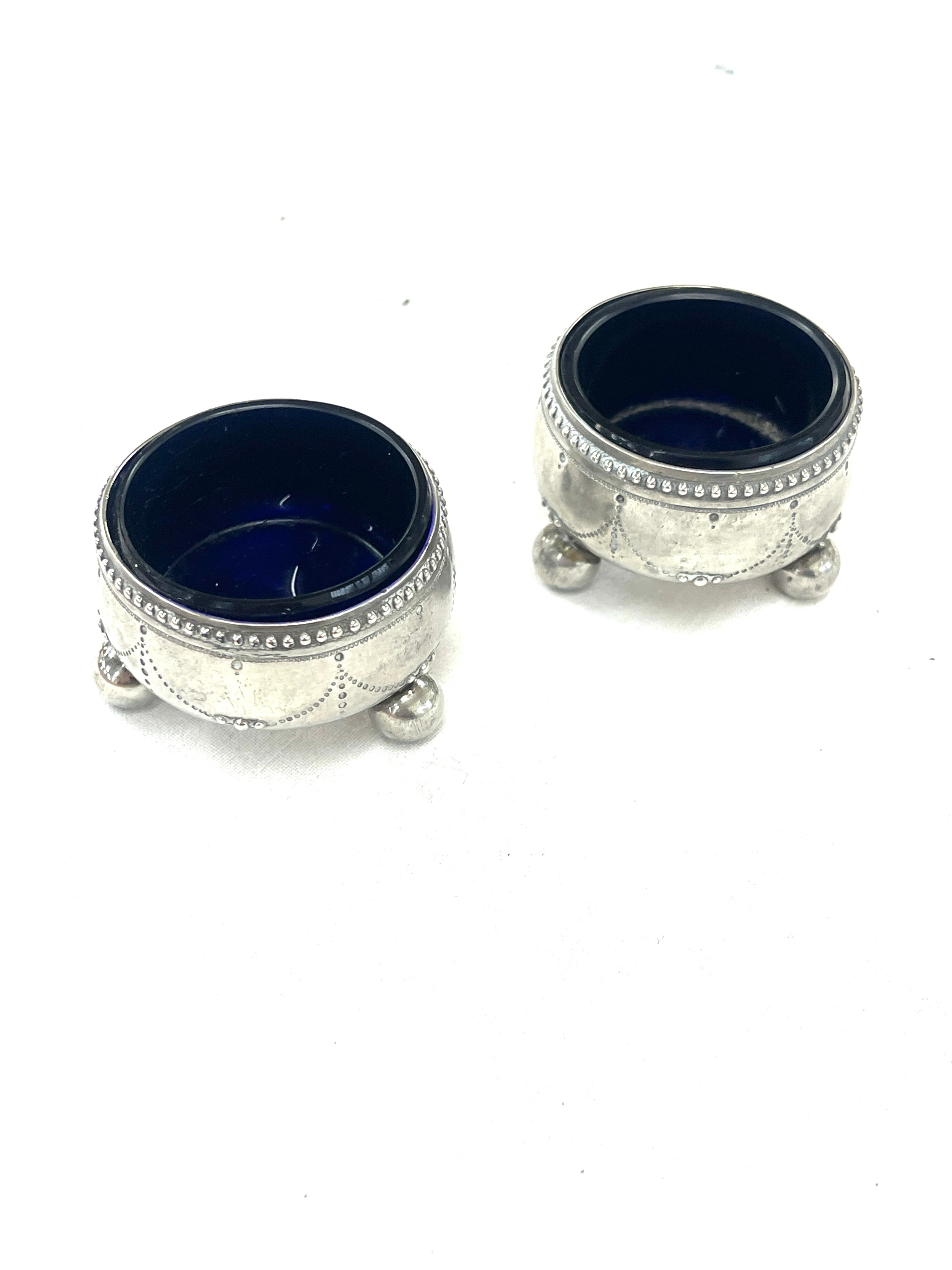 Pair of silver salts makers mark WE with glass liners, total weight 60.88 grams