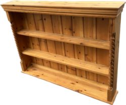 Pine three shelf book case damage to left corner measures approx 55 inches wide by 9 inches deep and