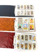 Selection of cigarette/ tea/ collectors cards in three albums includes full sets includes players,