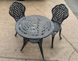 cast aliumium table and two chairs