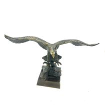 Brass eagle figure, 8 inches tall 13 inches wide