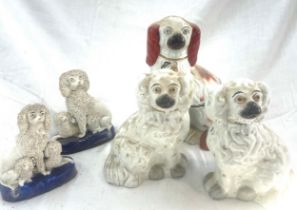 5 Antique Staffordshire dog figures, tallest measures approximately: 8.5 inches