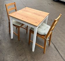 Pine table and two chairs