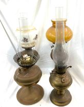 Selection of copper and brass vintage oil lamps with funnels, tallest measures approximately 23