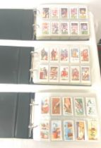 Selection of cigarette/ tea/ collectors cards in three albums includes full sets includes players,