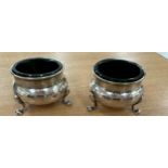 Two sterling silver salts with linens