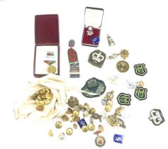 Selection of military items includes cap badges, buttons, medals etc