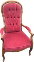 Upholstered mahogany button back armchair